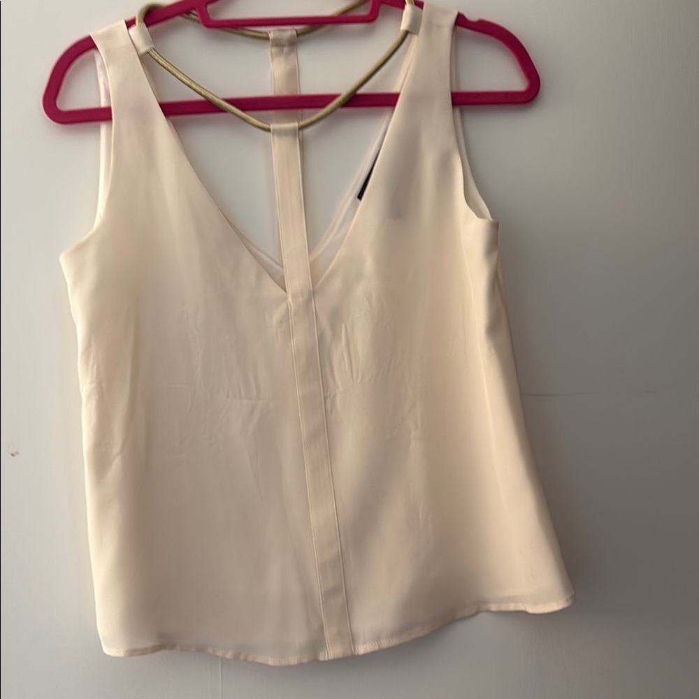 White blouse with gold neckline